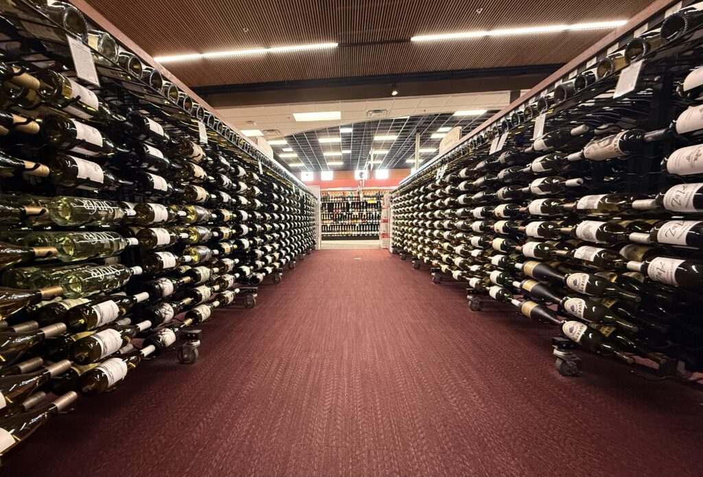 View of an aisle of wine at liquor store #3